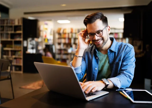 Man in office using Google calendar answering service for appointment management - Australia