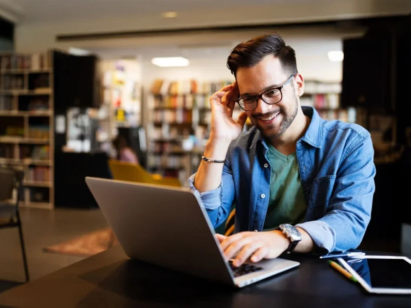 Man in office using Google calendar answering service for appointment management - Australia